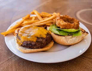 Cheeseburger Plate With French Fries And Onion Ring
