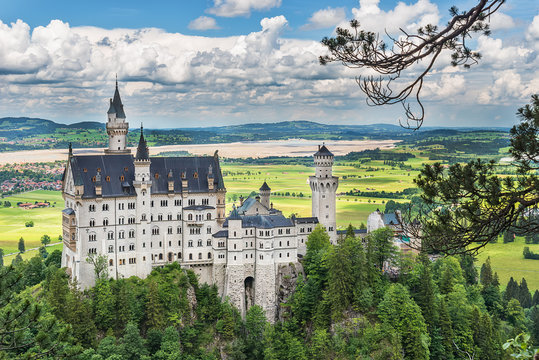 Hohenschwangau, Germany - June 10, 2018: The idyllic Neuschwanstein Castle positioned high up on a mountain in the Bavarian Alps. Commissioned by King Ludwig II of Bavaria.