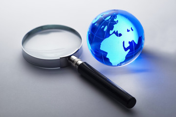 Glass globe with a magnifying glass