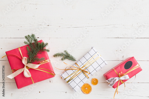 top view on nice christmas presents decorated with ribbons tree branch and orange slices on - Nice Christmas Gifts top view on nice christmas presents decorated with ribbons tree branch and orange slices on - Nice Christmas Gifts