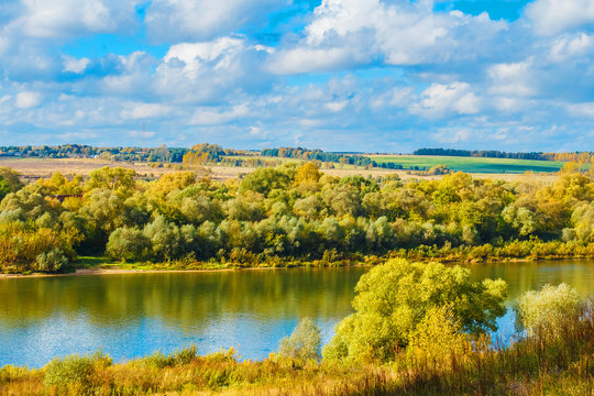 Picturesque autumn landscape. Yellow trees on a blue sky © smartape