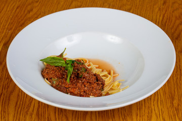 Pasta Bolognese with basil