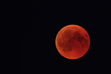 Obraz na płótnie Canvas Total lunar eclipse on July 27, 2018, photographed from the palatinate forest in Germany.