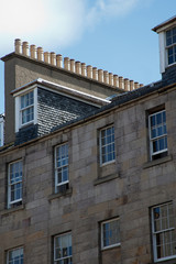 Facade of Edinburgh Town House showing rows of chimney pots