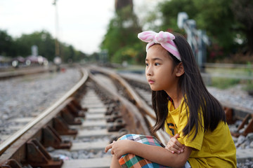 Fototapeta premium Portrait Asian cute little girl Railway background
