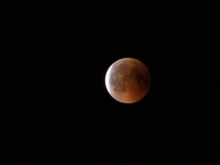 Scenery of Blood Moon during longest total Lunar Eclipse of XXI century on black sky from Poland in...