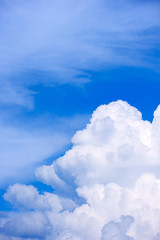 Naklejka na ściany i meble Cumulus clouds in the blue summer sky