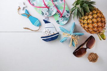 Sunglasses and summer accessories on white background