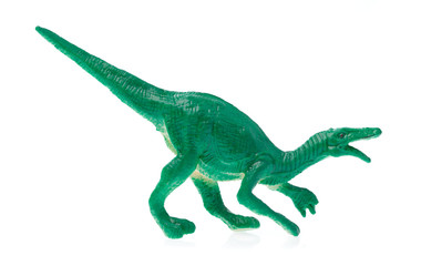 Fototapeta premium zabawka mały dinozaur na białym tle