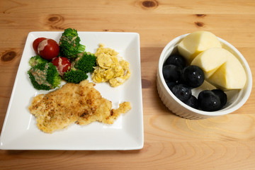 Home cooked dish with fruit as dessert