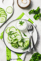 Vegetarian low calorie cucumber and fennel salad with yogurt dressing. Top view, space for text.