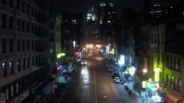 Timelapse tilt up of Chinatown traffic Manhattan New York