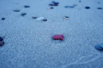 Small pebbles on a sandy beach. Beach Amber. Kaliningrad region. Russia.