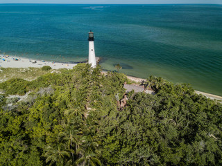 The restored Cape Florida Lighthouse on Biscayne Bay south of Miami Florida and the clear gorgeous...