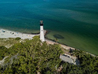 The restored Cape Florida Lighthouse on Biscayne Bay south of Miami Florida and the clear gorgeous...