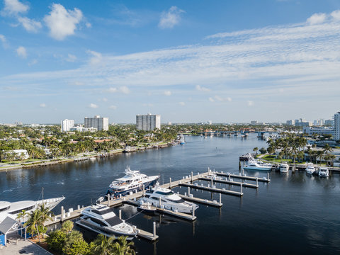 Excess and wealth expressed in large yachts docked along a waterway in Fort Lauderdale Florida
