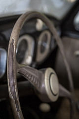 Fototapeta na wymiar Old worn driving wheel of a car