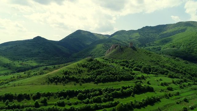 Drone flight at Coltesti Fortress, Transylvania, Romania on a spring sunny day with beautiful clouds