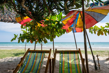 Mae Ram Phueng Beach, the beautiful and quiet for relaxation on the good holiday, is the attractions in Rayong, Thailand.  There are two seats on the front beach that under the palm trees, 