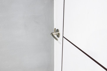 Handles on the white door in condo apartment 