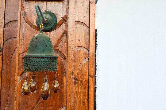 The edges of the Egyptian traditional bell tower bell on the building with brown glass balls are dripping. Arab Islamic Islamic decoration of buildings