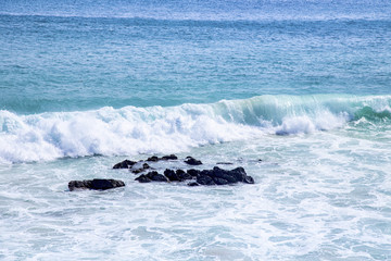 Beautiful beach and tropical sea with crashing wave