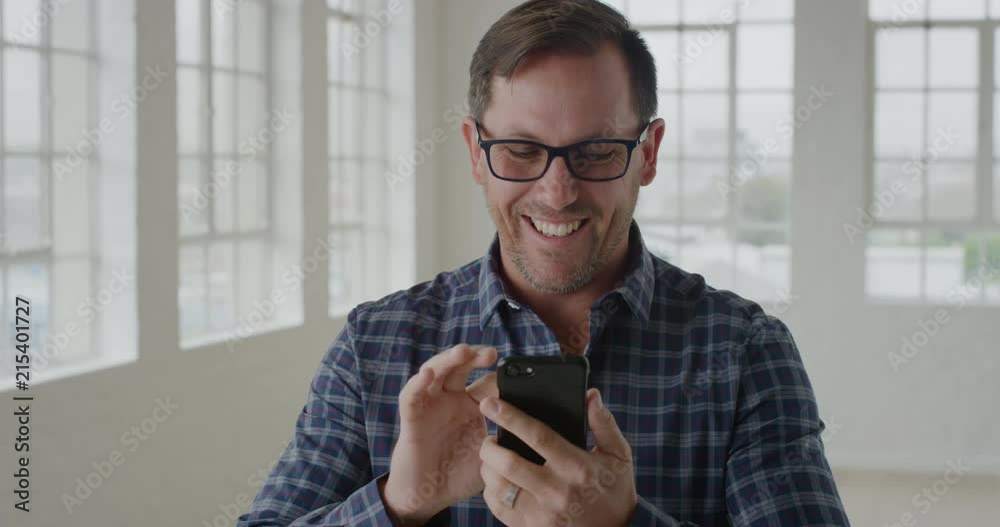 Wall mural portrait of businessman entrepreneur using smartphone texting browsing sending messages on mobile ph