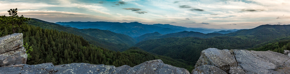 Calm scenery springtime very green landscape, stitched panorama with picturesque view and rocks in Rhodope mountain near the village of Ravnogor in Pazardzik county, Bulgaria