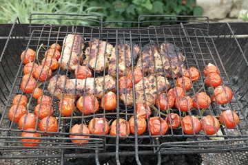 pork with cherry tomatoes on grill