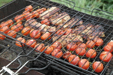 pork with cherry tomatoes on grill