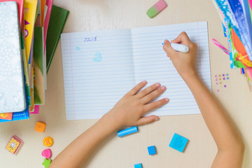 Yong school girl makes her homework