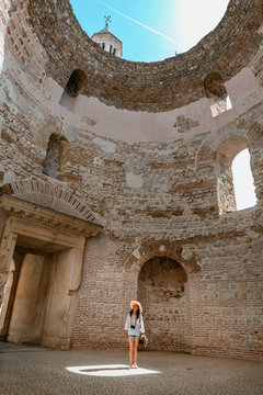 A asian women traveler standing on the light spot in beautiful old town Split in Croatia