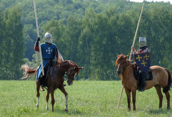 medieval knight with a spear riding a horse