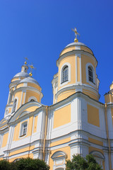 Fototapeta premium Saint Vladimir's Cathedral in St. Petersburg, Russia. Neoclassical Simple Architecture of Russian Orthodox Cathedral, Summer Day View of City Church Domes on Empty Blue Sky Background
