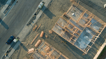 Drone Aerial View of Home Construction Site Foundations and Framing