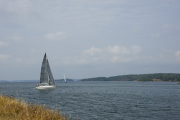 Sail boat at  od fortress Oscar Fredriksborg from 1900:s outside Stockholm in Vaxholm