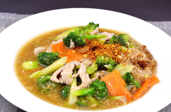 pork and Broccoli and carrot in thick gravy with thin rice noodles
