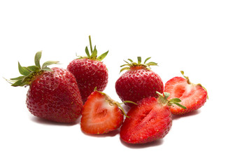 Fototapeta na wymiar Strawberry with sliced half and leaves isolated on white background with clipping path. Strawberry whole and cut into halves. Close-up. Red strawberries.