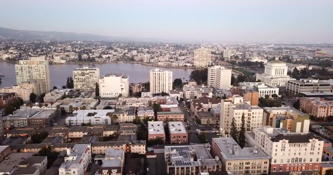 Dusk Falls on The Buildings and Skyline of Oakland, CA and Lake Merritt