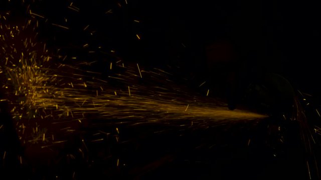 sparks effect - worker cutting iron