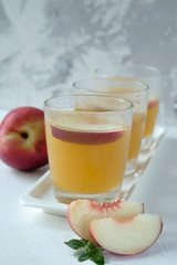 Nectarine juice in glass cups