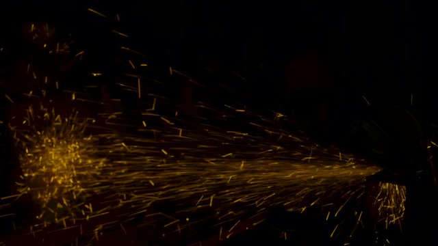 sparks effect - worker cutting iron