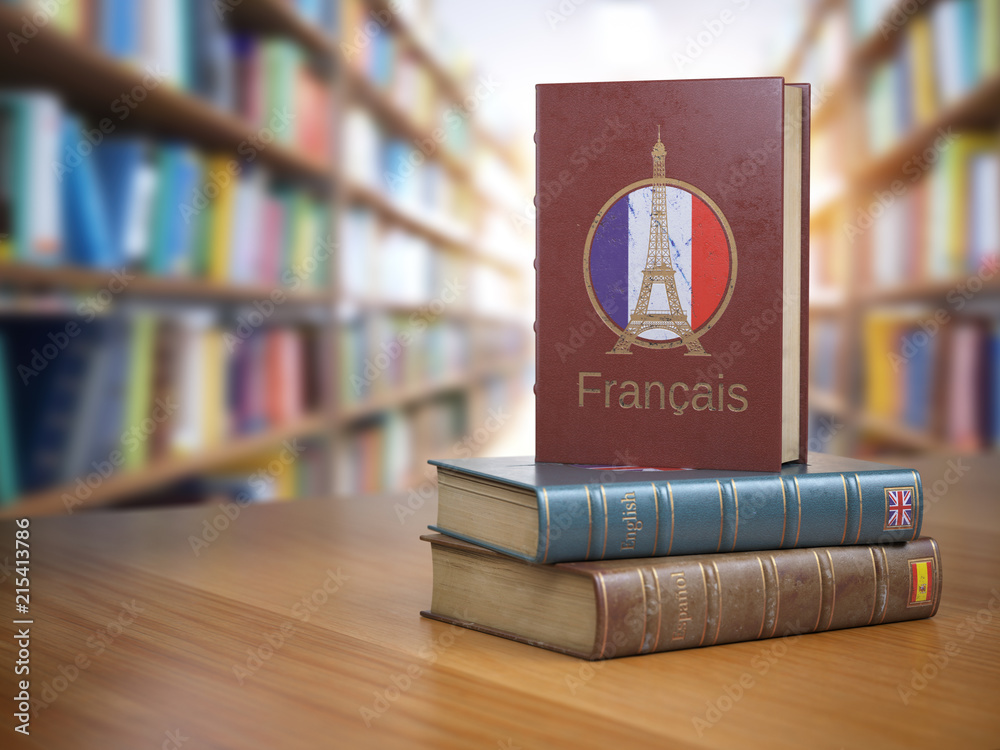 Poster learn french concept. french dictionary book or textbok with flag of france and eiffel tower on the 