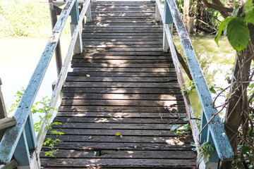 Old wooden bridge with wooden walkway