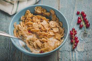 Organic flakes in blue bowl
