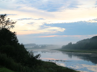 evening clouds on the river after sunset