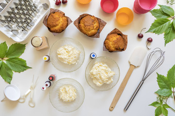 on white background cake molds, spatula, corolla, cones for cream,