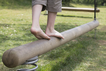 Go ahead. Success steps. Boy legs on a balance beam. Follow your dreams.
