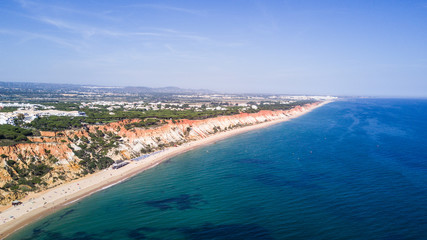 Fototapeta na wymiar Aerial view of Algarve Beach. Beautiful Falesia beach from above in Portugal. Summer vocation in Portugal.