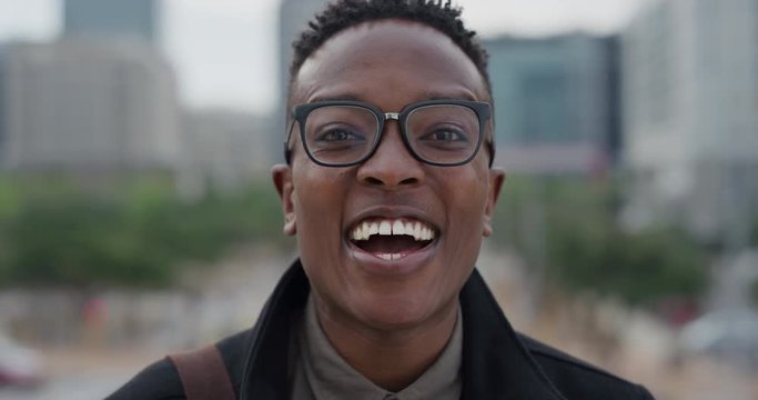 portrait successful african american man student laughing enjoying professional lifestyle success happy black male wearing nerd glasses